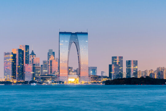 Night view of Jinji Lake and Gate to the Orient in Suzhou, Jiangsu Province, China