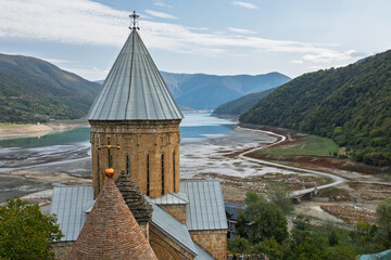 Ananuri Fortress Tower Over Exposed Zhinvali Reservoir In Georgia