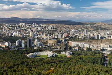 Panoramic View Of Tbilisi Cityscape With Stadium And Mountains