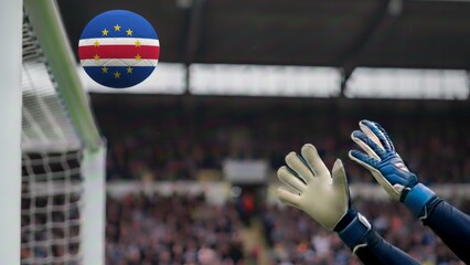 Dynamic soccer action with a Cape Verde flag ball nearing the goal, goalkeeper's hands poised for