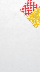 Red and yellow checkered pattern on a white background