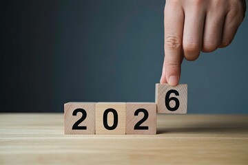 Finger placing block to complete year 2026