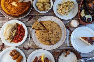 Spanish food banquet with tortilla, croquettes, and cheesecake