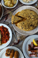 Spanish food spread showing tortilla de patatas and tapas
