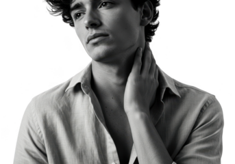 Young man with hand on neck isolated on transparent background