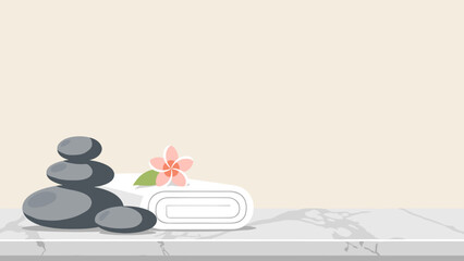 Stack of stones and a folded towel on a marble table with copy space