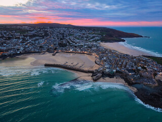 Vibrant twilight elevated capture of St Ives town, bay and beaches in Cornwall, UK