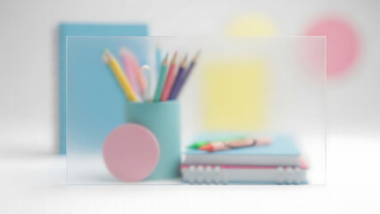 Colorful art pencils behind a blurred glass serve as essential school and office stationery supplies for drawing and education