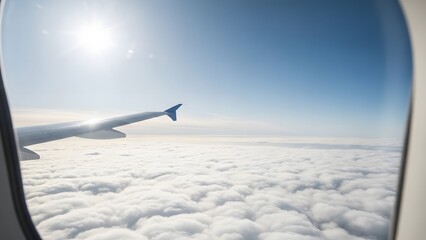 View from airplane window above the clouds