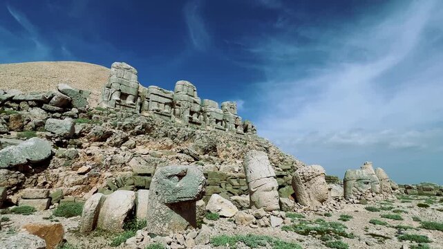 Turkey, Adiyaman, May 3, 2024: ruins at the top of Mount Nemrut. Destroyed ancient statues in the Taurus Mountains. Ancient stone heads on top of Mount Nemrut. 4К