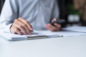 Businessman typing hands and phone internet for social media.