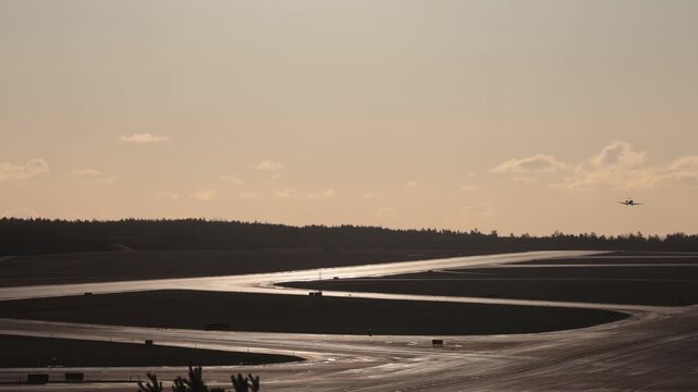Stockholm Sweden A commercial airliner lands on the runway on a crisp sunny day at Arlanda Airport.
