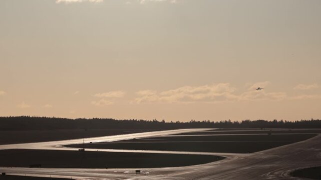 Stockholm Sweden A commercial airliner lands on the runway on a crisp sunny day at Arlanda Airport.