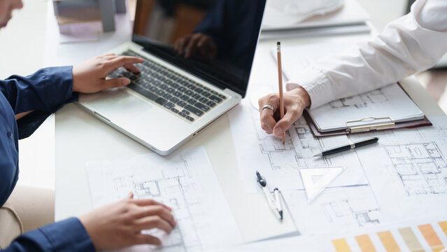 Architecture drawing on architectural project business architecture building construction Colleagues designer Planning Design on blueprint and compasses
