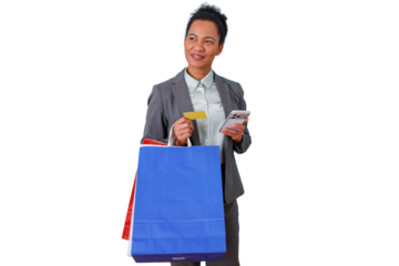 Businesswoman holding shopping bags, credit card and smartphone engaging in online retail and mobile payment