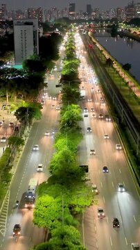 Night Freeway Road At Marginal Pinheiros Sao Paulo Brazil. Breathtaking Aerial View Of Busy Traffic In A Freeway Road. Building Clouds Sky Illuminated Urban. Town Outdoors Downtown Panoramic City.
