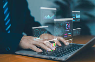 Businessman analyzing virtual data dashboards on laptop, showing business intelligence, analytics reports, financial charts, global data visualization, digital technology, and modern corporate.