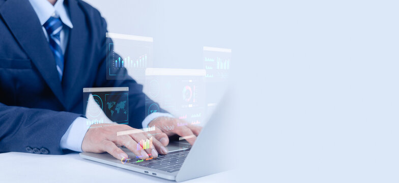 Businessman working on laptop with virtual data analytics dashboard, financial charts and digital interface overlay, representing business intelligence, data analysis, technology, strategy. - Powered by Adobe