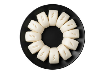 Steamed Buns Displayed on a Round Black Plate