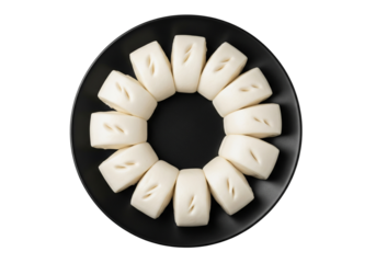 Steamed Buns Displayed on a Round Black Plate