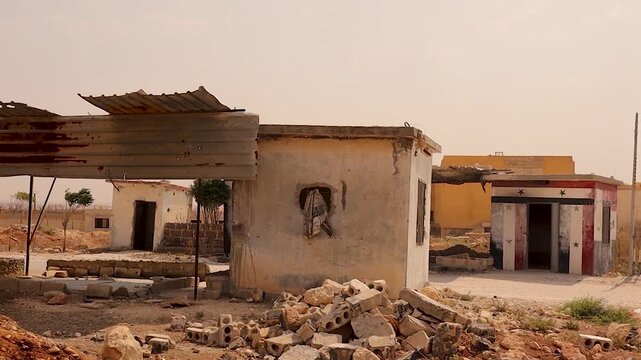 Abandoned former Assad Syrian army checkpoint near Aleppo after the end of war. Powerful symbol of regime collapse and change, ideal for documentaries, conflict analysis, Middle East history archives.