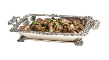 A beautifully presented dish of food in an ornate silver serving dish on transparent background