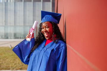 African american graduate woman smiling, holding diploma, celebrating academic milestone