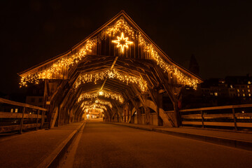 the famous historic wooden bridge of Bremgarten, Switzerland ist decorated for christmas