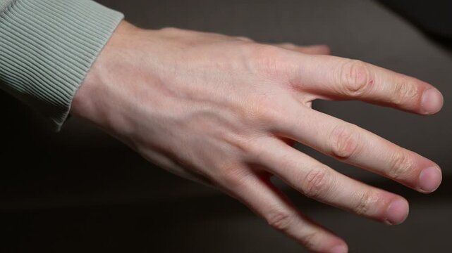 1111A man clenches his fist.
Close-up of a man's fist.
A strong man clenches his fist in anger and nerves.
