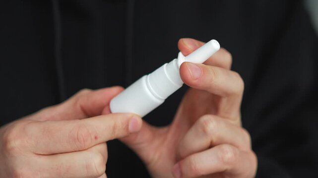 Asthma spray.
Close-up of a bottle of medicine in a person's hands.
Cold medicine.
Seasonal allergy and nasal decongestant spray.
Nasal congestion medicine.
Breathing, vinca, swelling, problems, colds