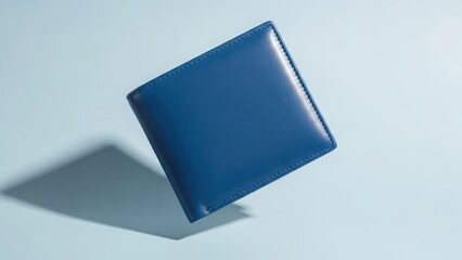 Blue leather wallet floating in air with shadow on light background