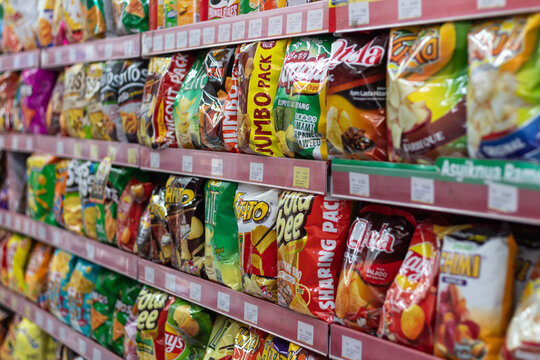 Shelves stocked with various snack chips in Mataram, Indonesia, 9 June 2025