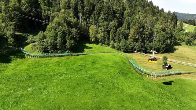 Aerial summer view of the Kronberg with cable car and panoramic alpine landscape