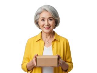 Smiling elderly Asian woman with short grey hair, wearing a yellow shirt, holding a small cardboard box, isolated on white background. isolated on transparent background