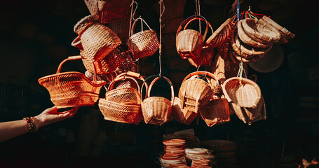 Baskets hanging in a lively market environment.