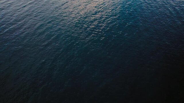 Sunlight creates patterns on the water surface in an ocean scene during daytime