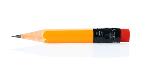Short pencil on white background close-up, school and office supplies concept with natural reflection and shadows