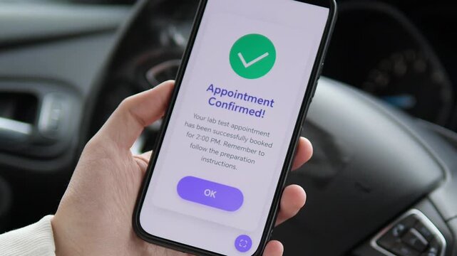 Mobile healthcare technology concept. A user interacts with a modern health app interface to schedule a blood test. The footage captures the transition from reviewing appointment details to the final