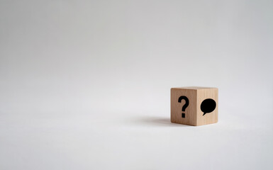Wooden Block with Question Mark and Speech Bubble for FAQ Concept
