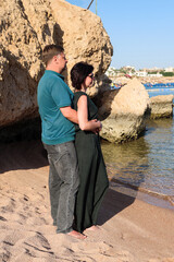 Mature couple in love beach in casual clothes.