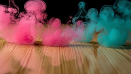 Colorful smoke clouds spreading across a wooden surface against a dark background