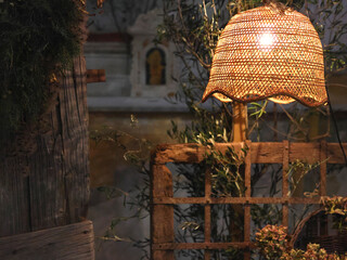Old vintage wooden furniture and wicker lamp in old house. Rustic style. Background for design. 