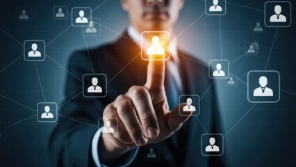 Businessman interacts with a digital network of people icons.