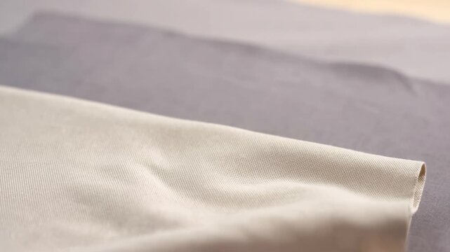 Iron gliding smoothly over fabric: flawless pressing technique in action