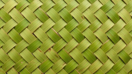 Woven green leaves create a textured natural pattern background.