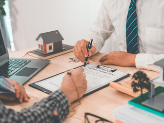 The customer is negotiating a home purchase agreement, with basic information regarding insurance or a home loan, after the bank has approved and signed the purchase agreement.