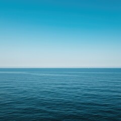 Obraz premium A vast, clear ocean horizon meeting a gradient blue sky. The perfect natural boundary creates a sense of endless potential and open space ,concept ,peaceful ,horizon