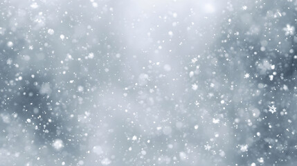 Fototapeta premium Dense winter snowfall with blurred flakes on light blue background
