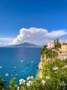 Scenic coastal view of Mount Vesuvius seen from Vico Equense on the Sorrento Coast. A classic Mediterranean landscape representing Italian travel, tourism, and seaside beauty.
