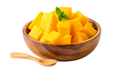Diced mango pieces in wooden bowl on white background